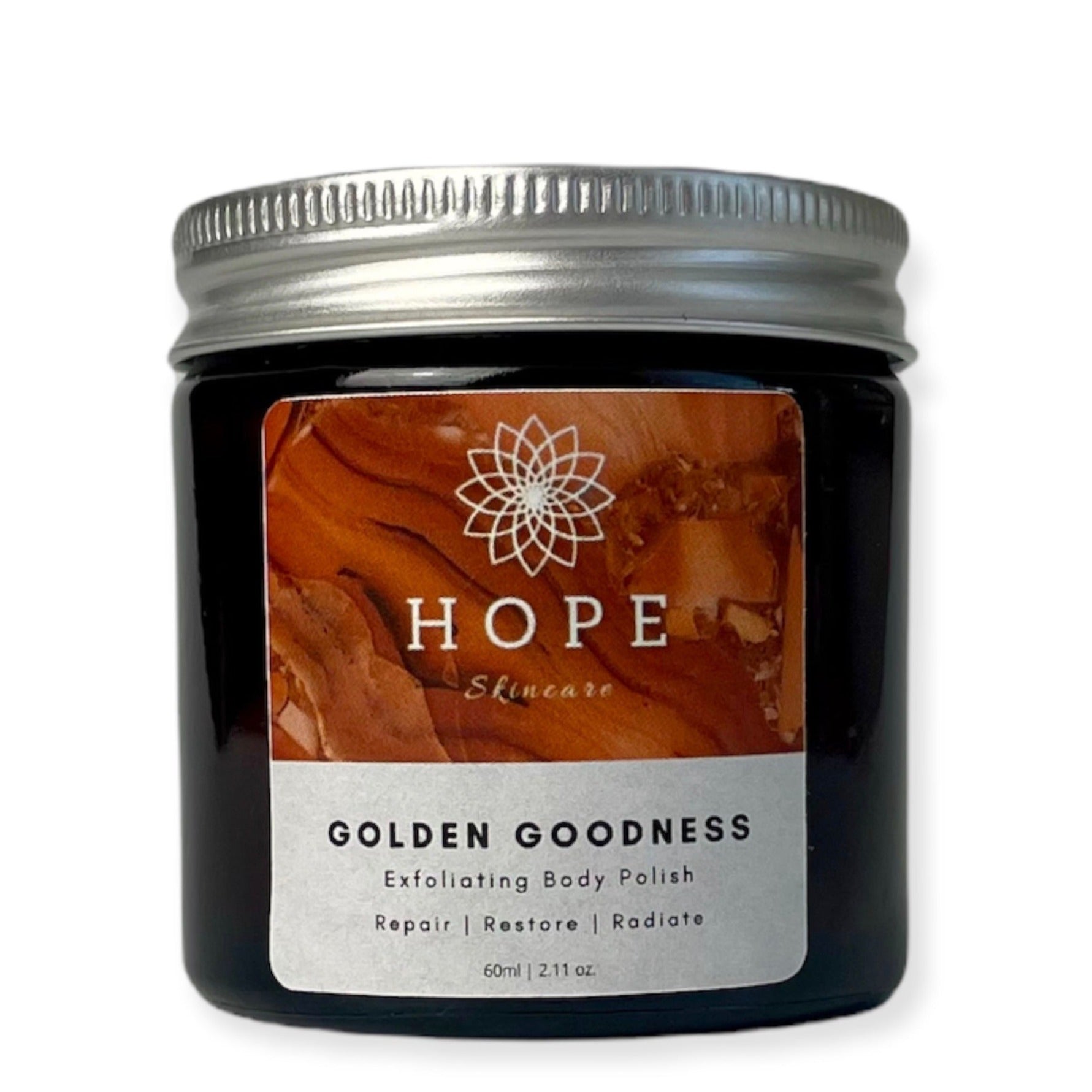 Golden Goodness Exfoliating Body Polish in a jar, showcasing its creamy texture and natural ingredients like papaya and shea butter.