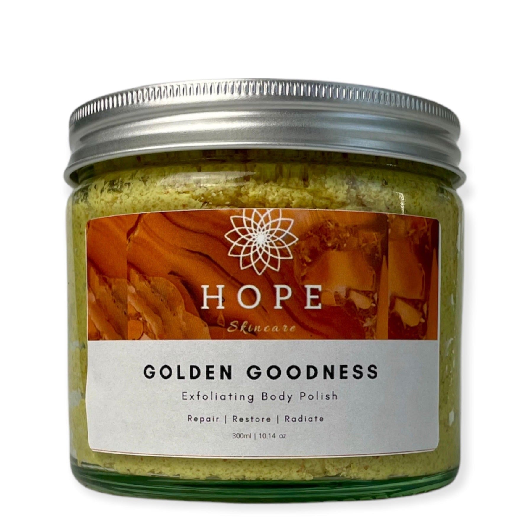 Golden Goodness Exfoliating Body Polish in a jar, showcasing its creamy texture and natural ingredients like papaya and shea butter.