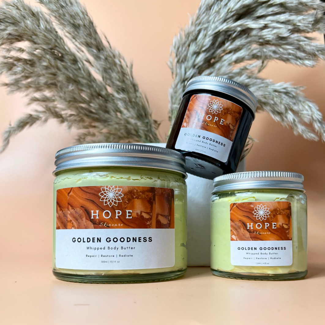 Golden Goodness Whipped Butter in a jar, showcasing its creamy texture and natural ingredients like Manuka honey and turmeric oil.