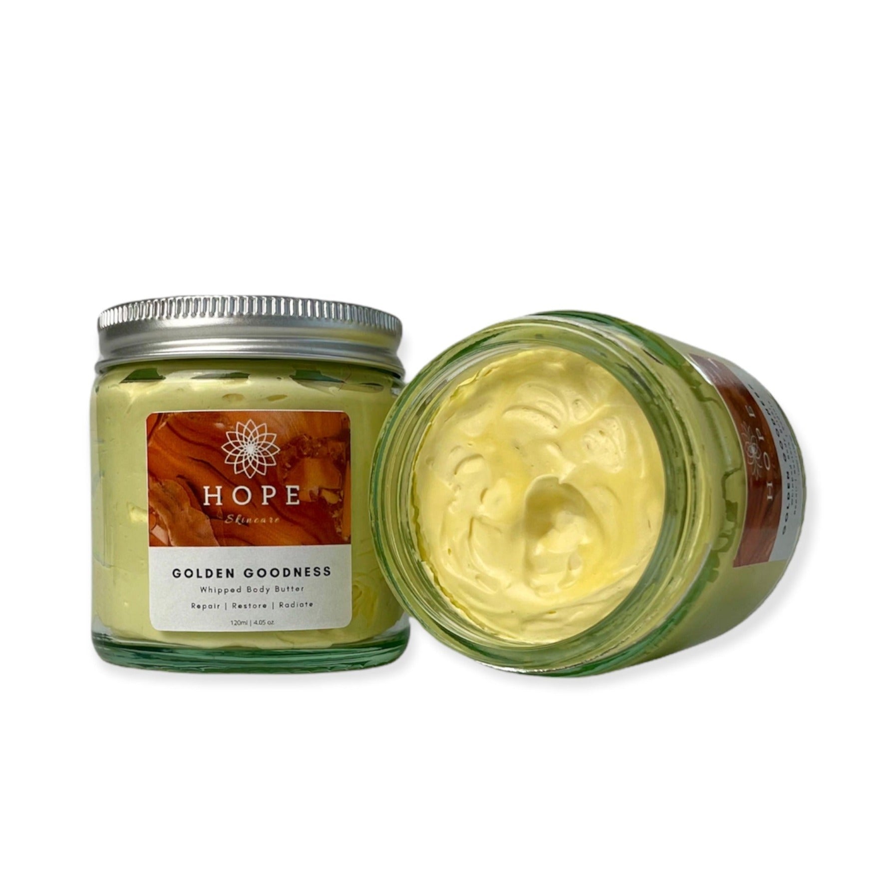 Golden Goodness Whipped Butter in a jar, showcasing its creamy texture and natural ingredients like Manuka honey and turmeric oil.