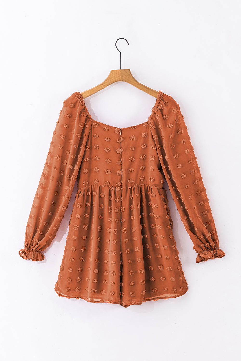 Grapefruit orange swiss dot romper with flounced bubble sleeves and square neck, showcasing a flowy fit silhouette.