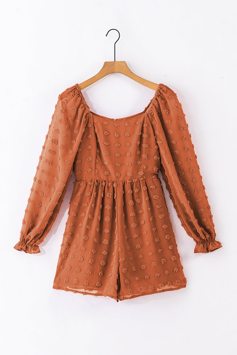 Grapefruit orange swiss dot romper with flounced bubble sleeves and square neck, showcasing a flowy fit silhouette.