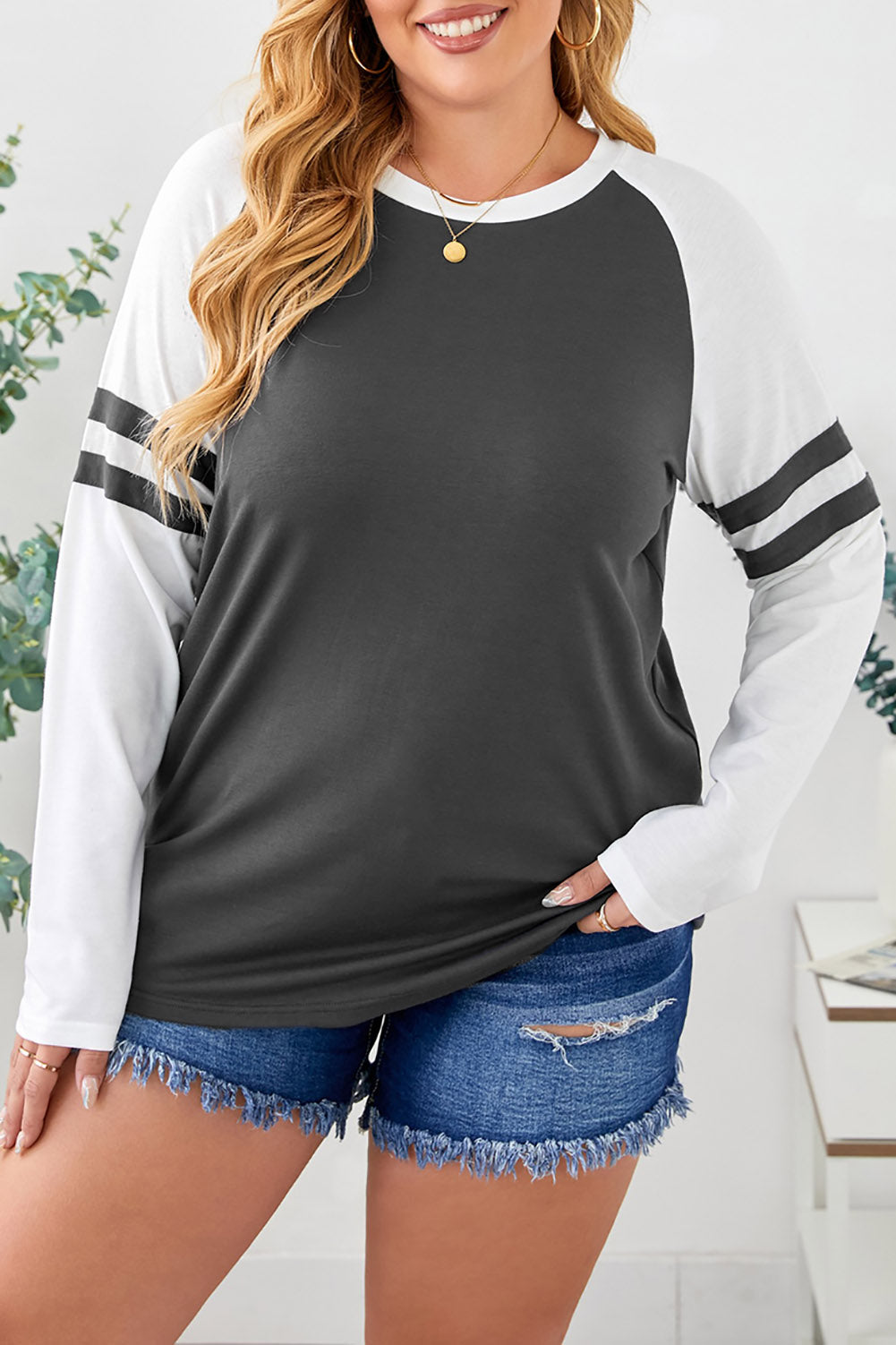 Gray crewneck top featuring striped splicing sleeves, designed for plus size women, showcasing a stylish patchwork design.