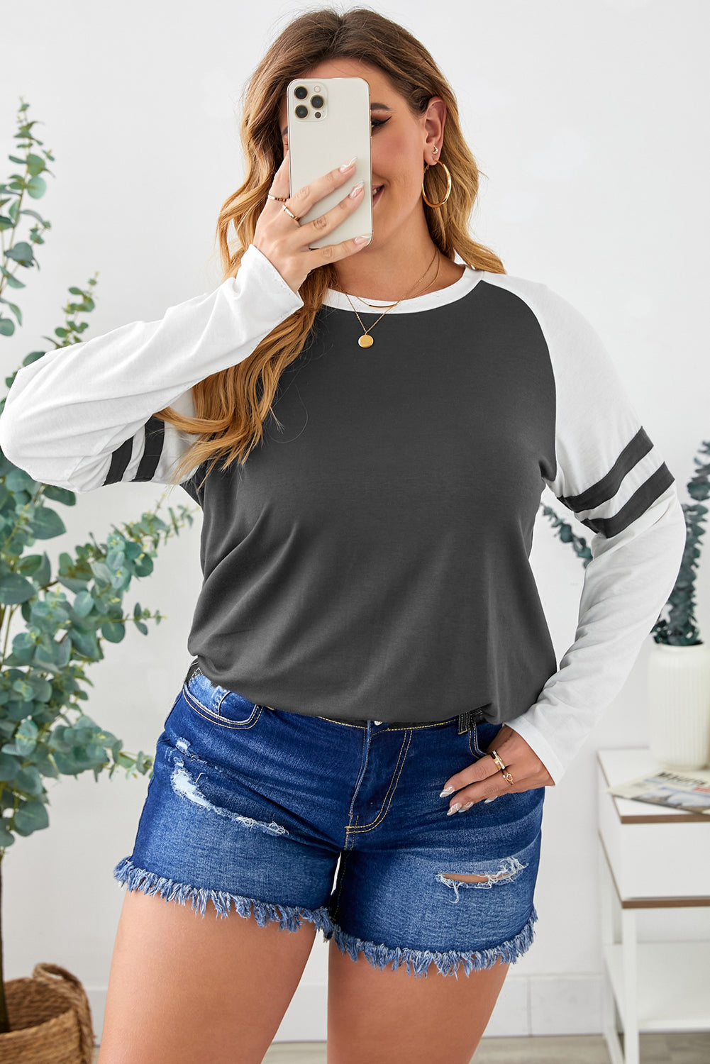 Gray crewneck top featuring striped splicing sleeves, designed for plus size women, showcasing a stylish patchwork design.