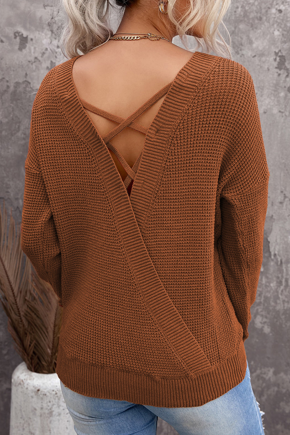 Gray Cross Back Hollow-out Sweater featuring a deep V hollow-out design and crisscross back, perfect for stylish layering.