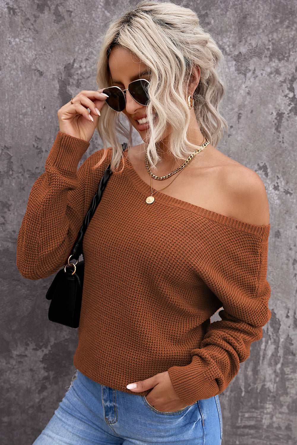 Gray Cross Back Hollow-out Sweater featuring a deep V hollow-out design and crisscross back, perfect for stylish layering.