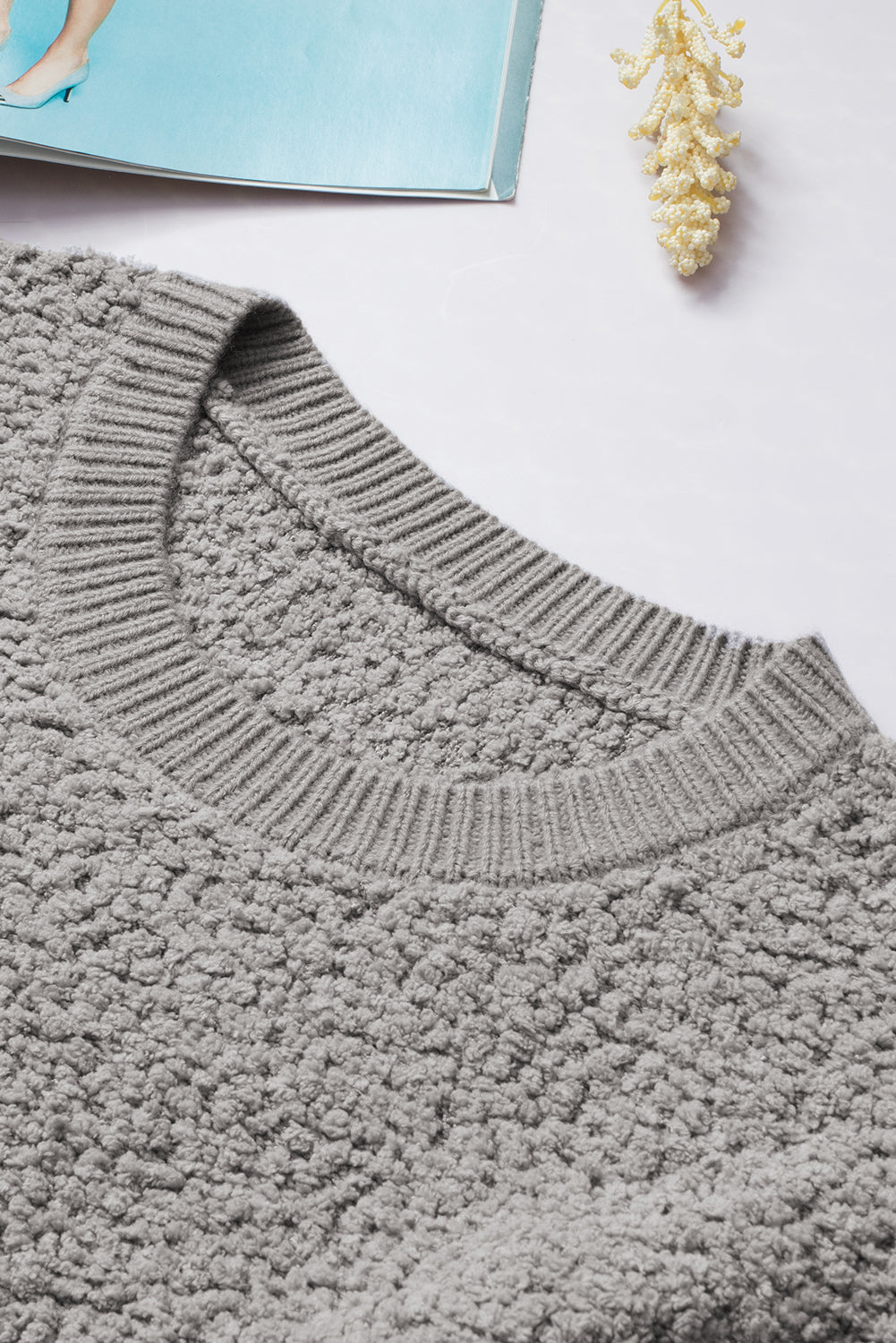 Gray Double Pockets Ribbed Trim Popcorn Knit Sweater with stylish design and soft texture, featuring double pockets and round neckline.