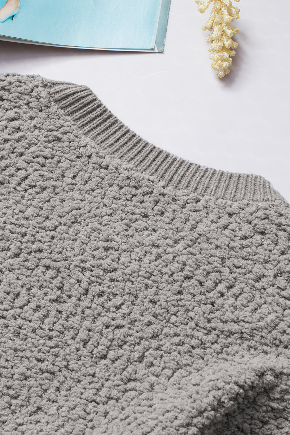 Gray Double Pockets Ribbed Trim Popcorn Knit Sweater with stylish design and soft texture, featuring double pockets and round neckline.