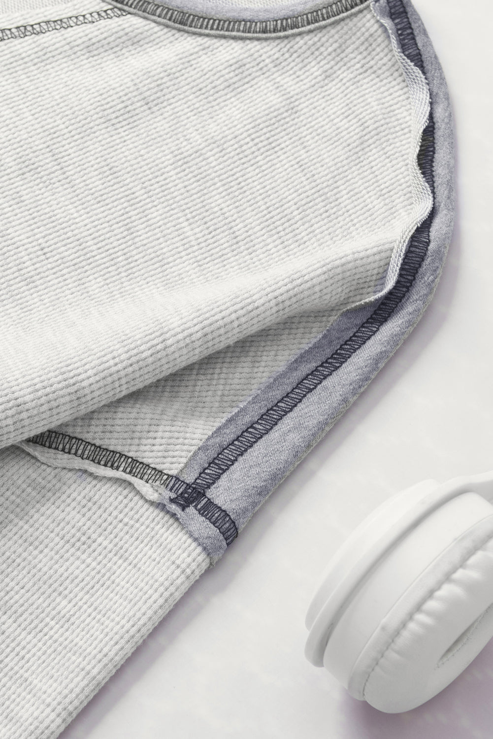 Gray Exposed Seam Ribbed Patchwork V Neck Sweatshirt showcasing unique seam details and a relaxed fit, perfect for casual wear.