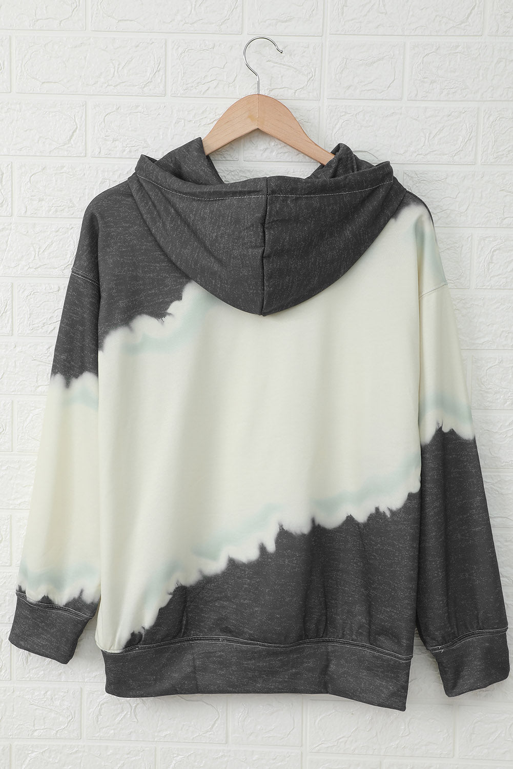 Gray hooded sweatshirt featuring a stylish tie-dye print and a functional front pocket, perfect for casual wear.