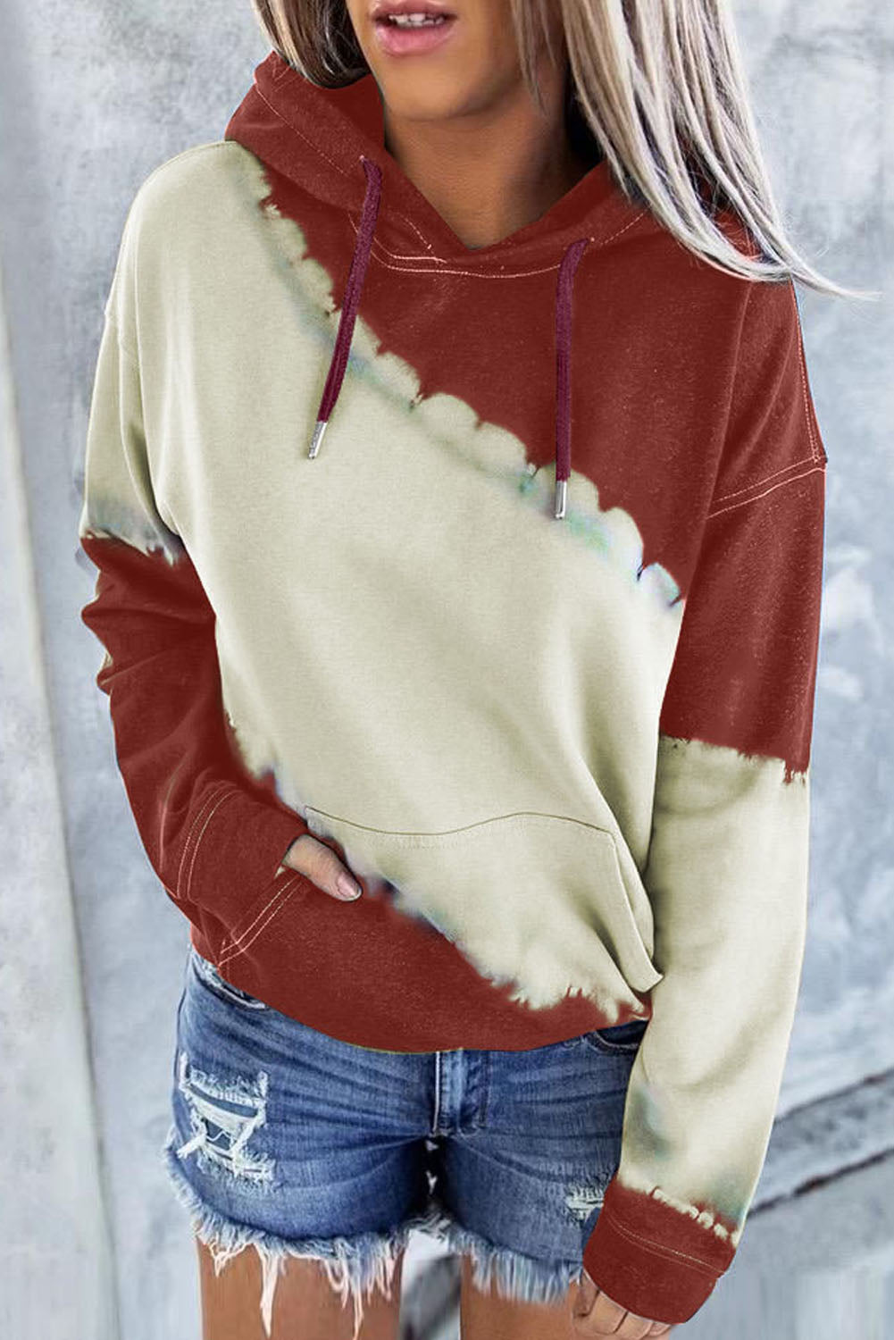 Gray hooded sweatshirt featuring a stylish tie-dye print and a functional front pocket, perfect for casual wear.