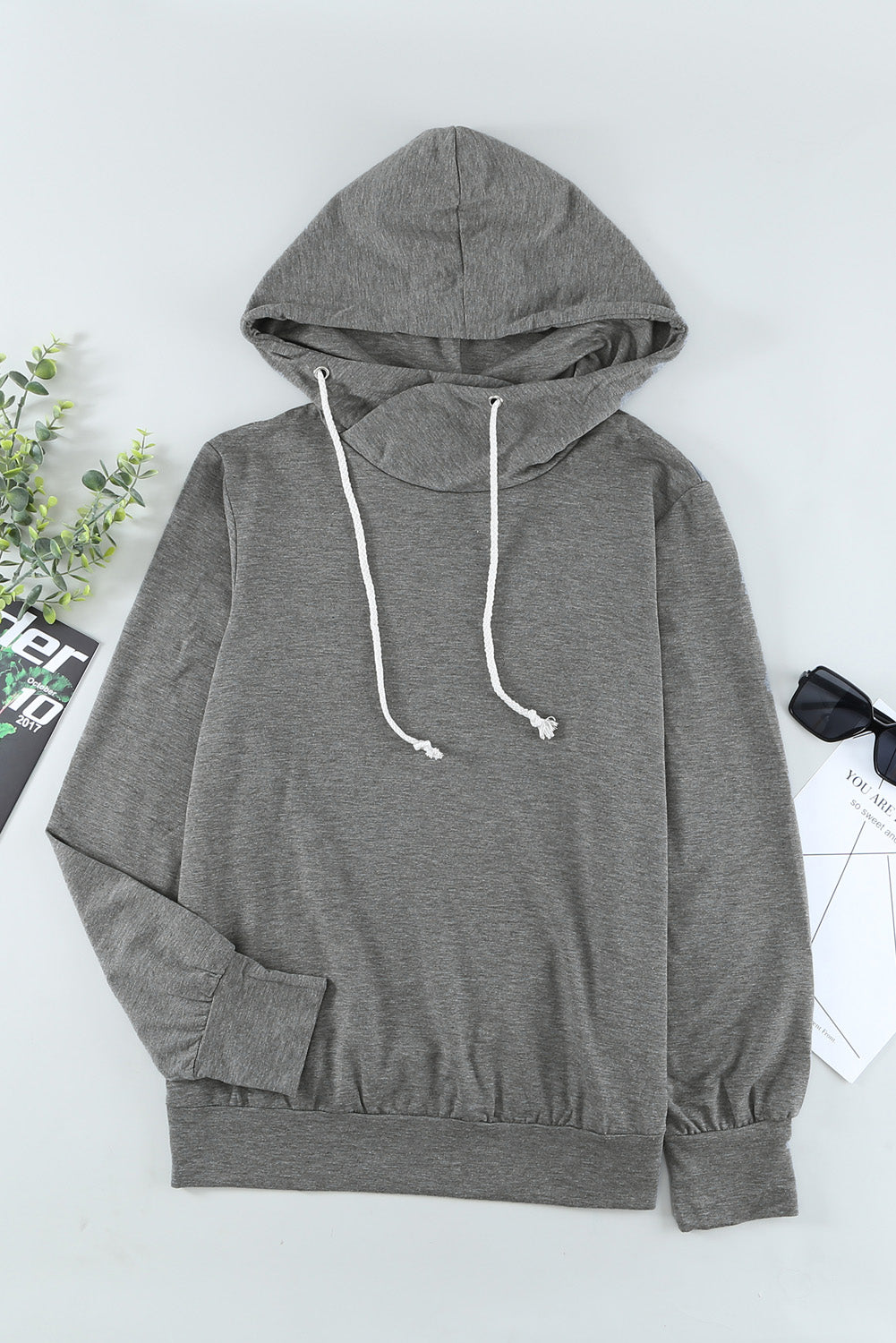 Gray long sleeve hoodie featuring a cowl neck and rope drawstring, designed for comfort and style.