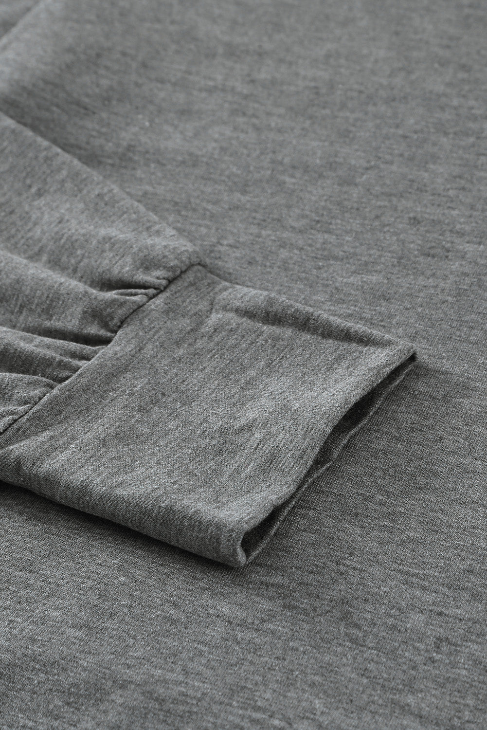 Gray long sleeve hoodie featuring a cowl neck and rope drawstring, designed for comfort and style.