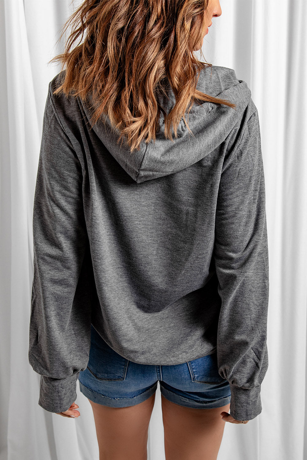 Gray long sleeve hoodie featuring a cowl neck and rope drawstring, designed for comfort and style.