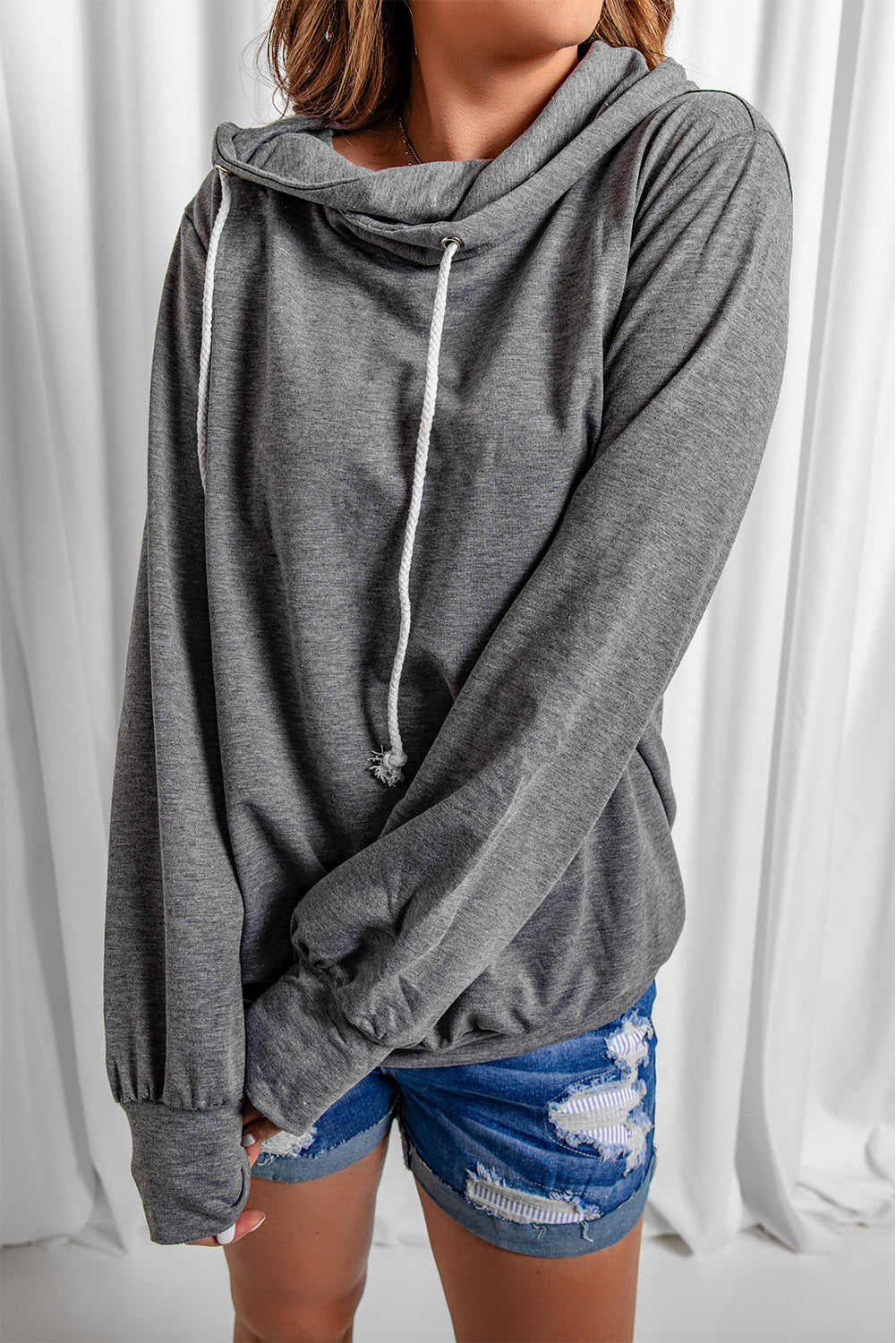 Gray long sleeve hoodie featuring a cowl neck and rope drawstring, designed for comfort and style.