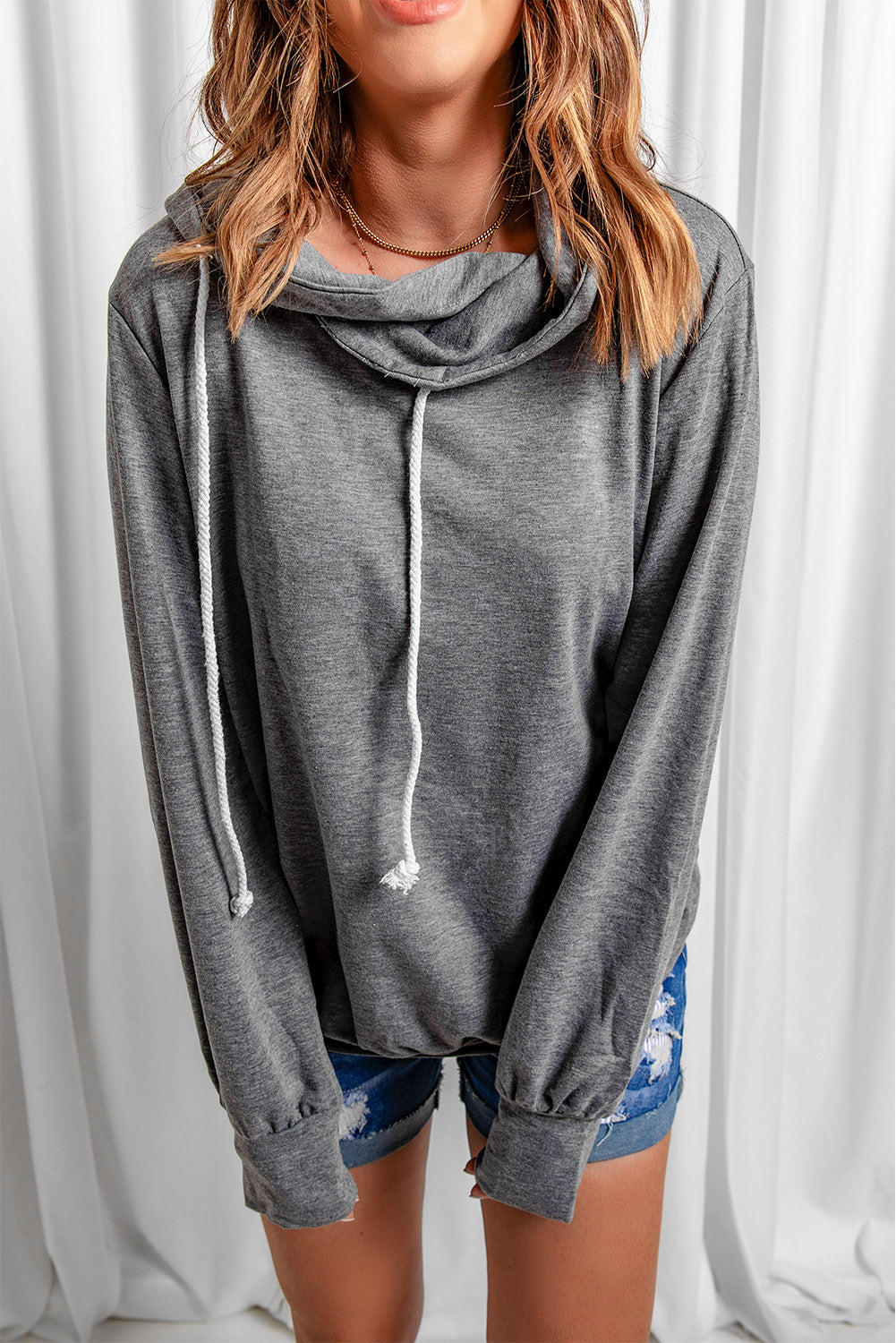 Gray long sleeve hoodie featuring a cowl neck and rope drawstring, designed for comfort and style.