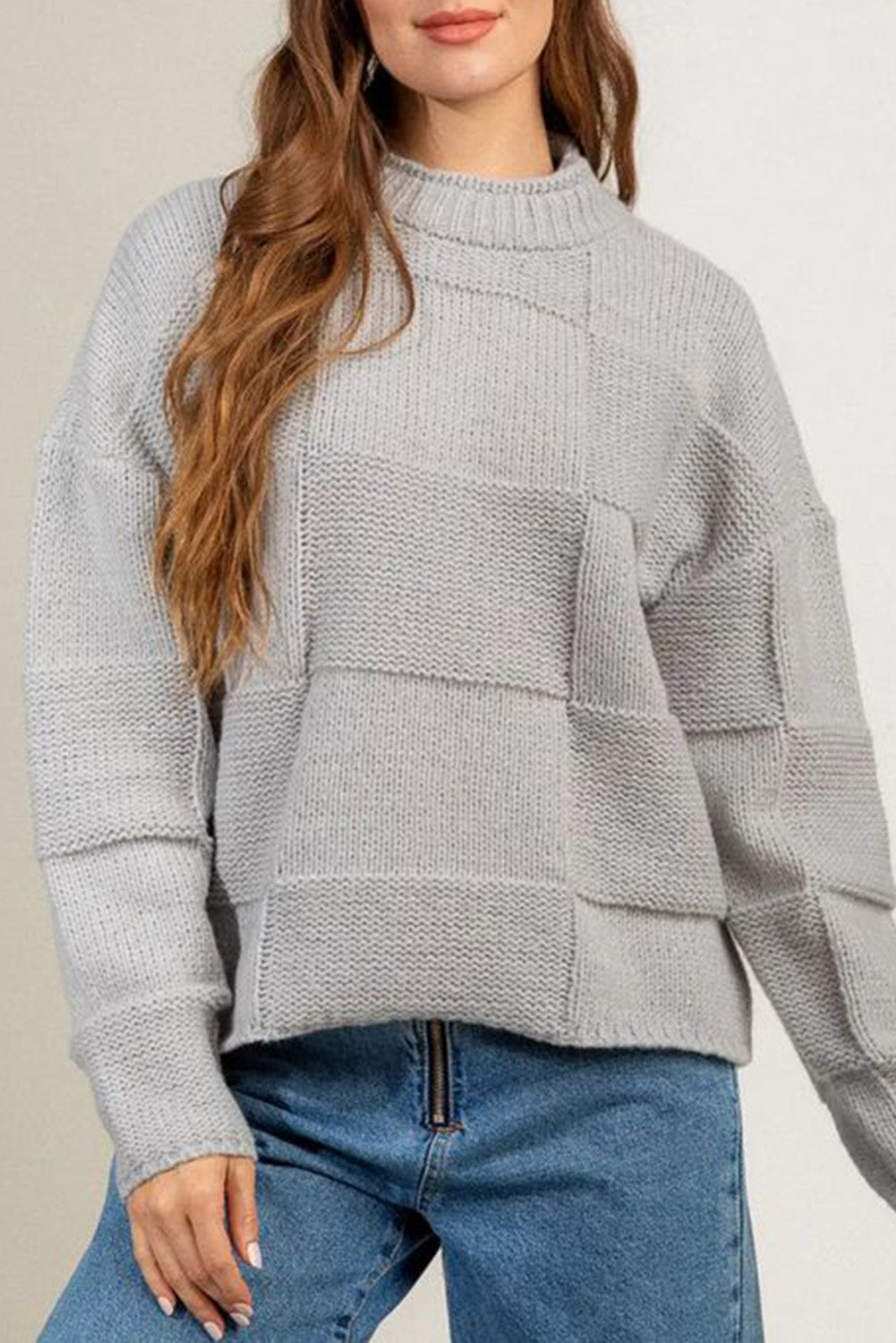 Gray mock neck checkered textured sweater displayed on a mannequin, showcasing its stylish design and soft fabric.