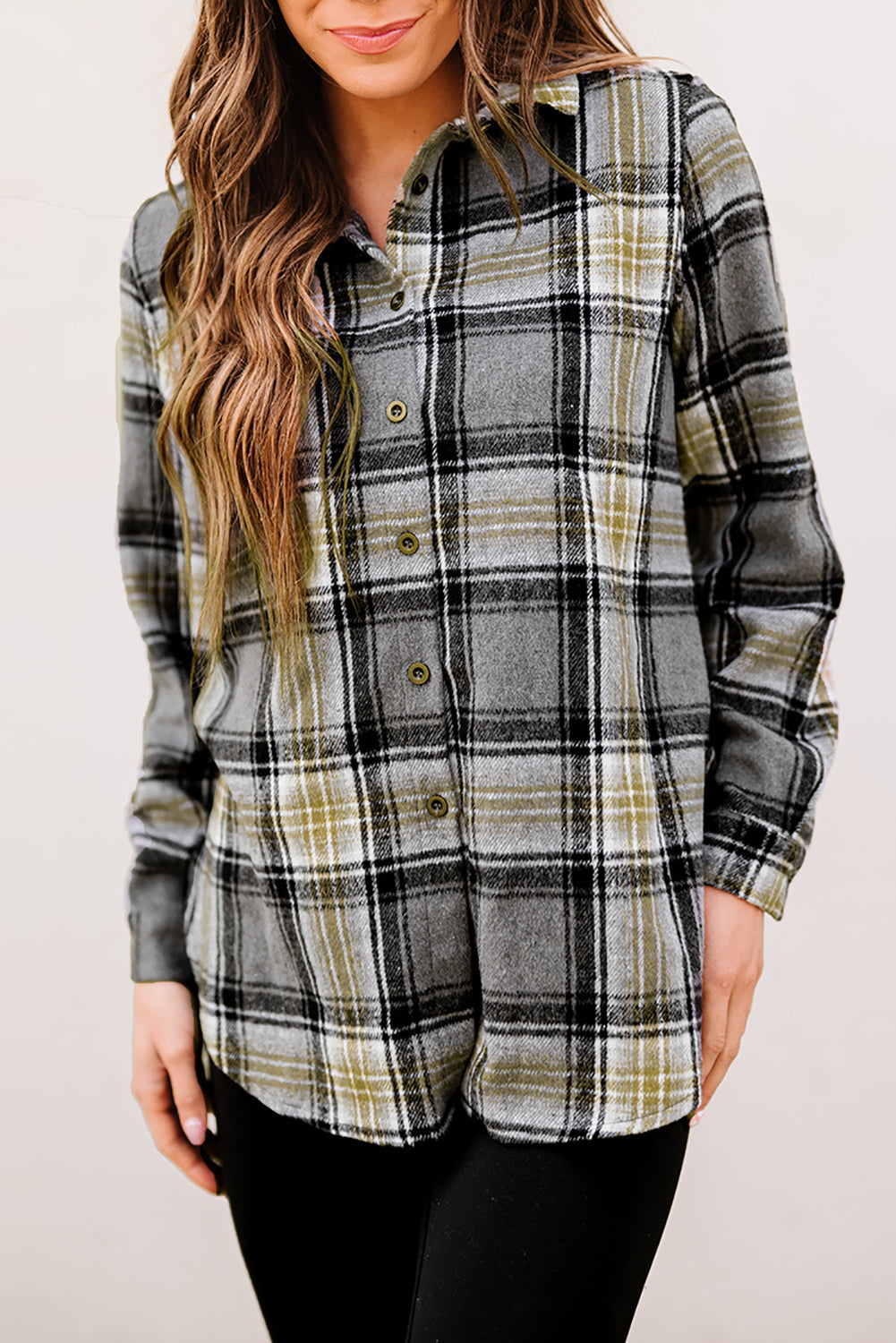 Gray oversize plaid shacket with rounded hem and slits, showcasing a stylish and comfortable design suitable for various outfits.