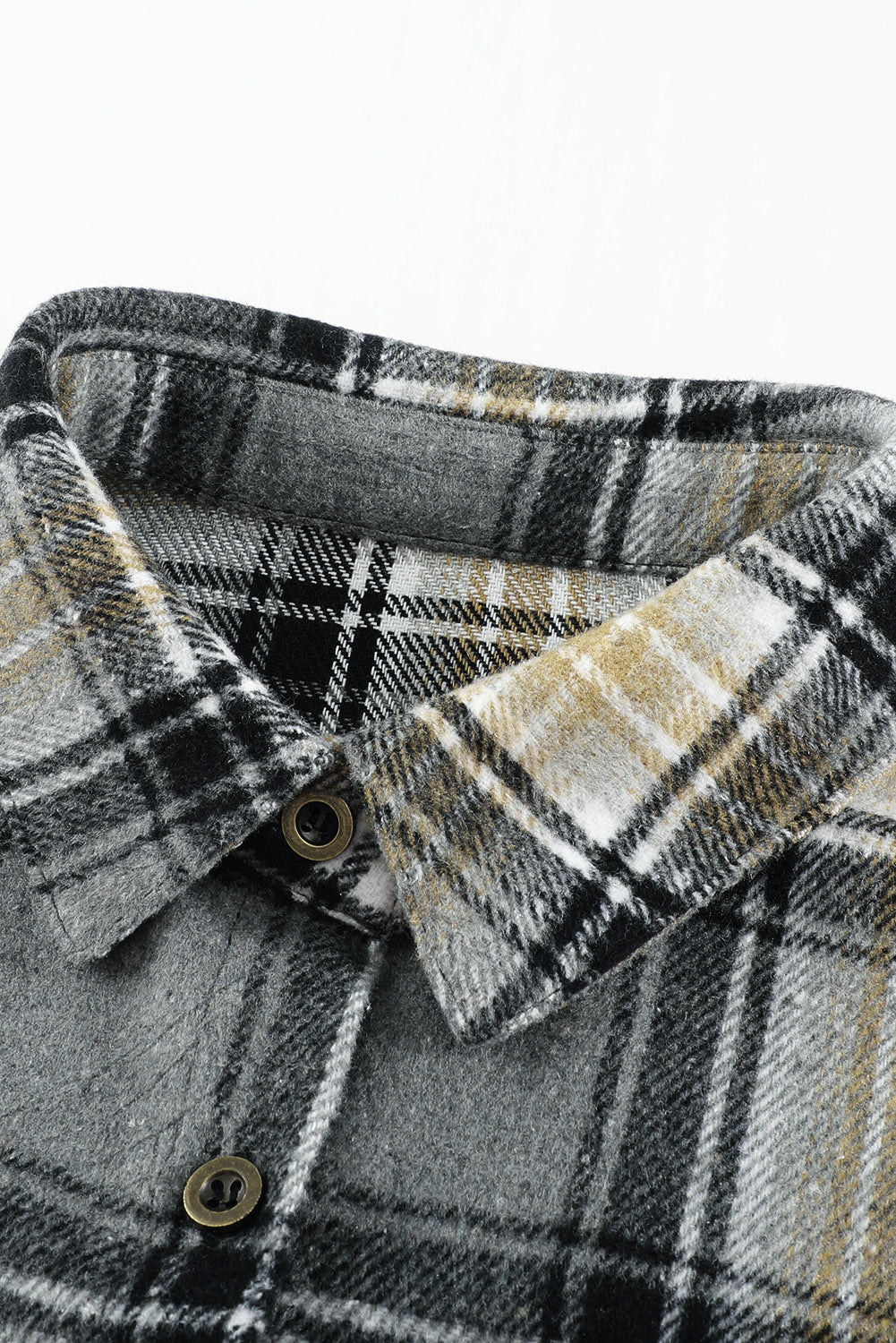 Gray oversize plaid shacket with rounded hem and slits, showcasing a stylish and comfortable design suitable for various outfits.