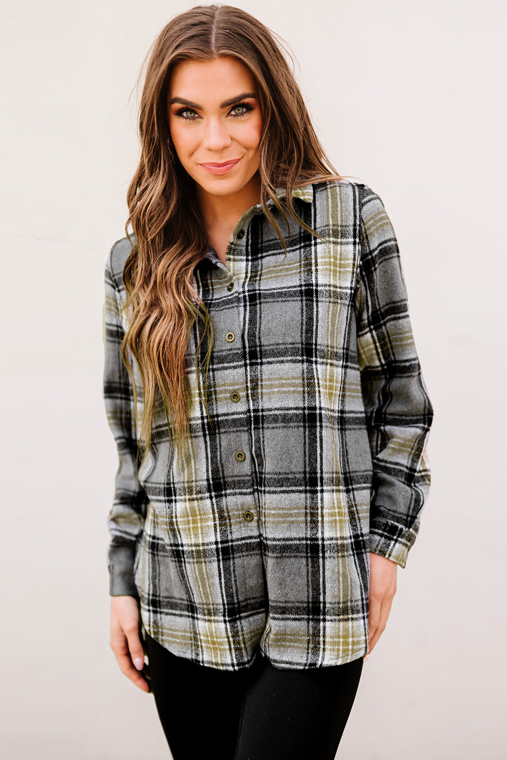 Gray oversize plaid shacket with rounded hem and slits, showcasing a stylish and comfortable design suitable for various outfits.