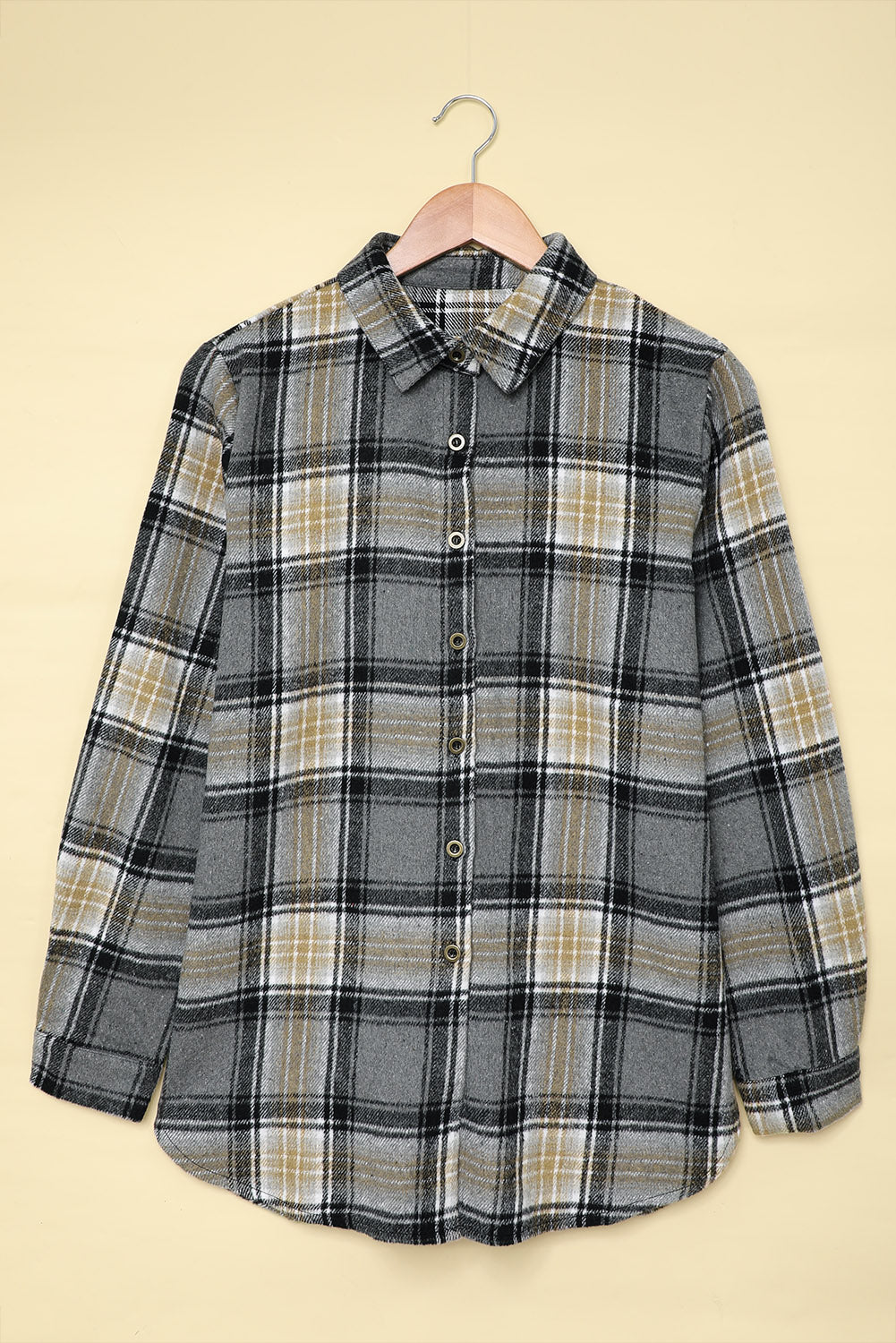 Gray oversize plaid shacket with rounded hem and slits, showcasing a stylish and comfortable design suitable for various outfits.