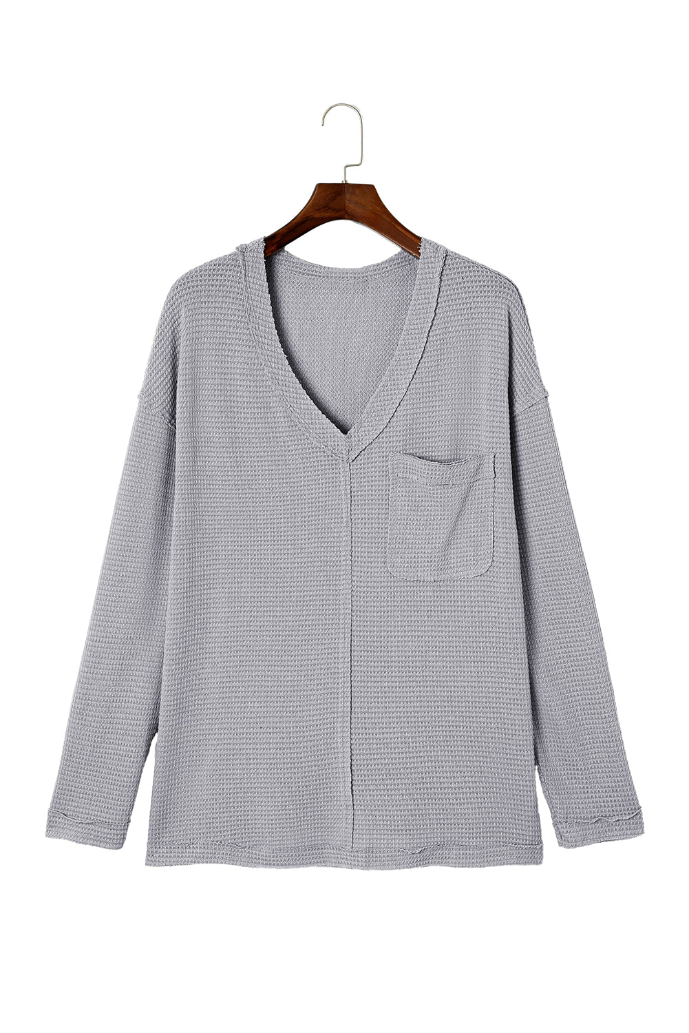 Gray Plus Size V Neck Raw Edge Long Sleeve Top displayed on a mannequin, showcasing its relaxed fit and trendy design.