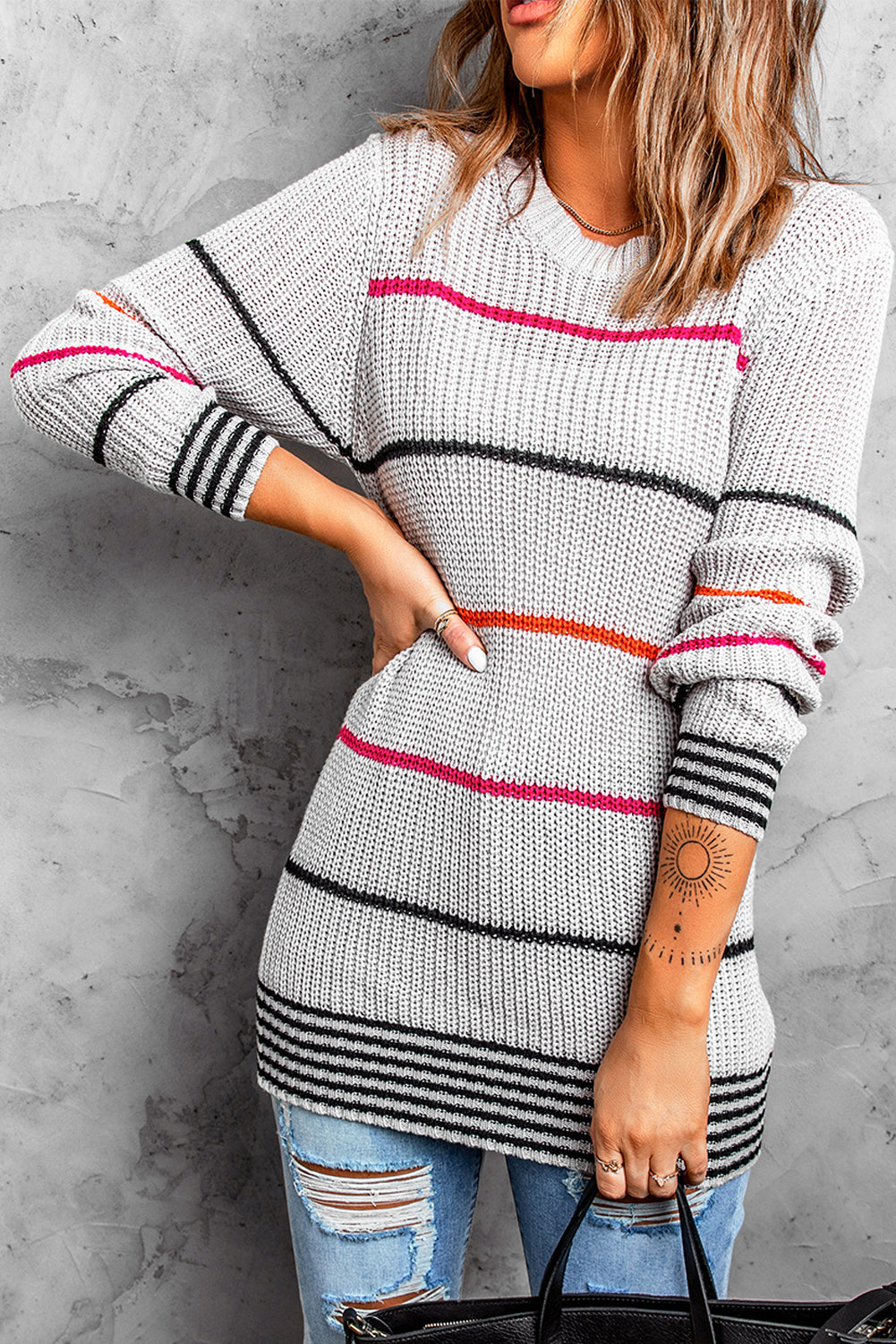 Gray ribbed knit striped sweater featuring colorful stripes, round neck, and long sleeves, perfect for stylish layering.