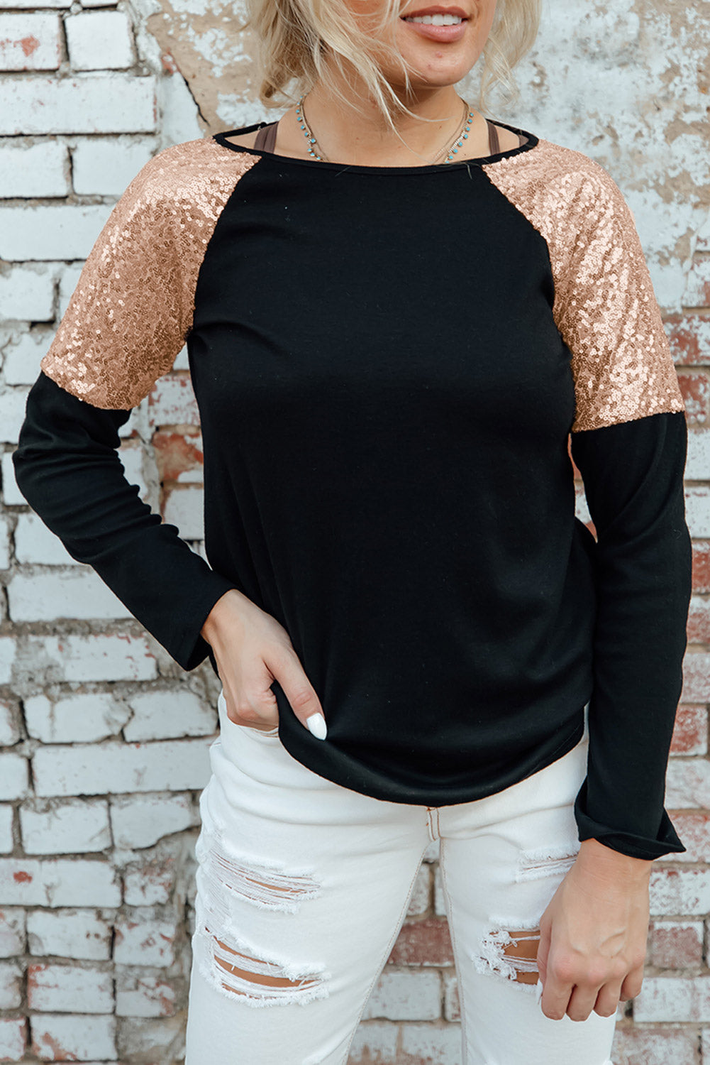 Gray long sleeve top with sequin shoulder detailing, showcasing a classic round neck and soft knit fabric.