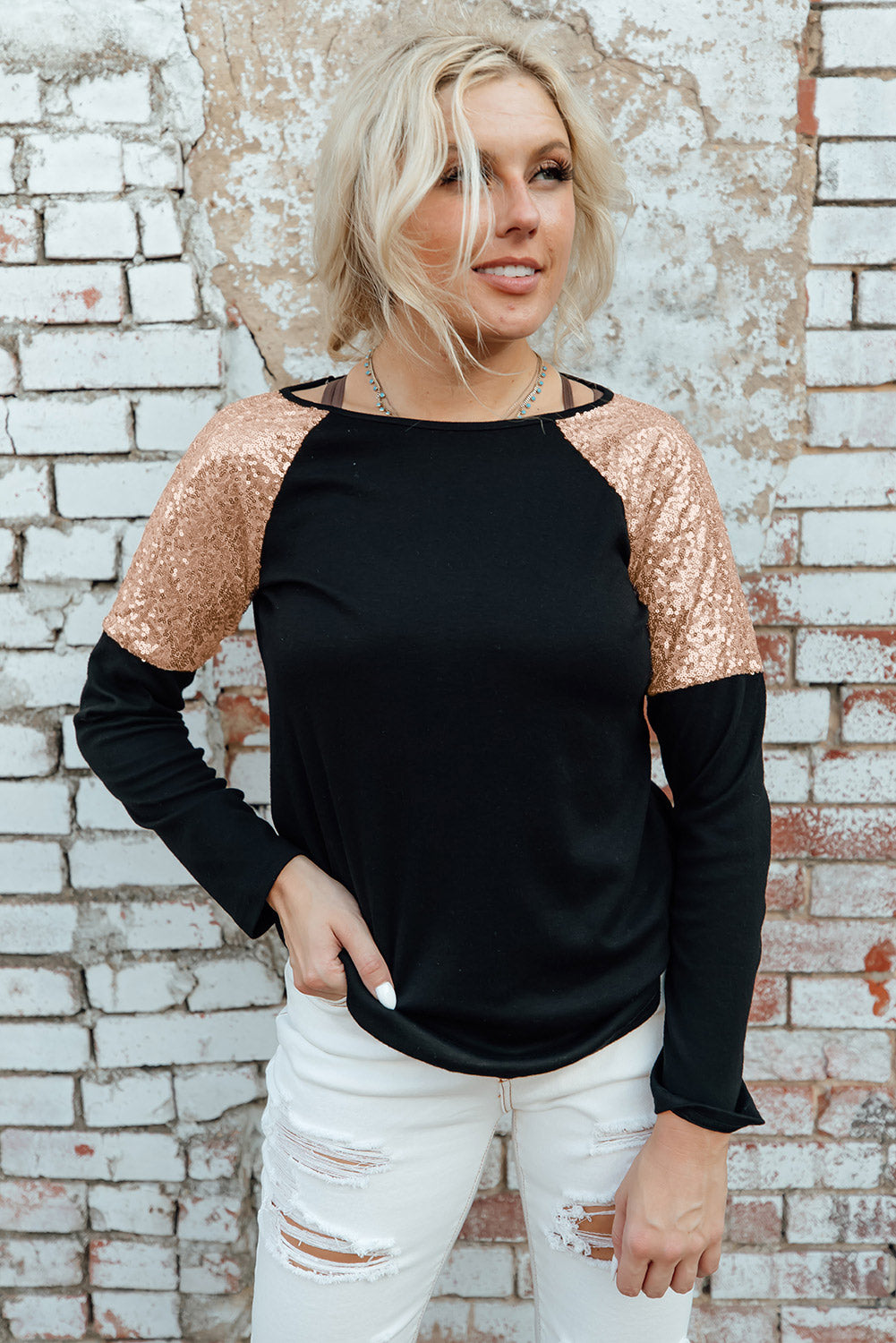 Gray long sleeve top with sequin shoulder detailing, showcasing a classic round neck and soft knit fabric.