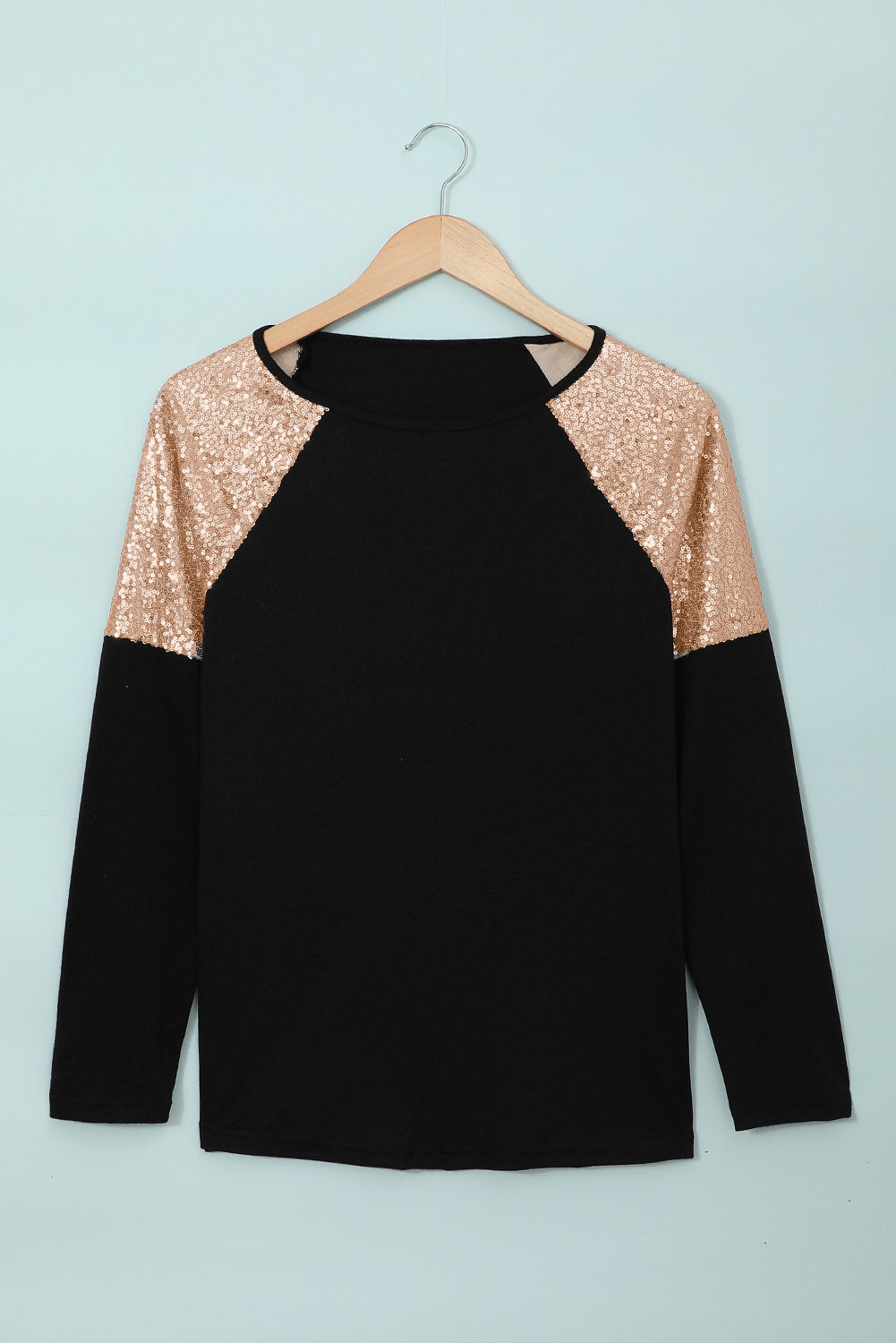 Gray long sleeve top with sequin shoulder detailing, showcasing a classic round neck and soft knit fabric.