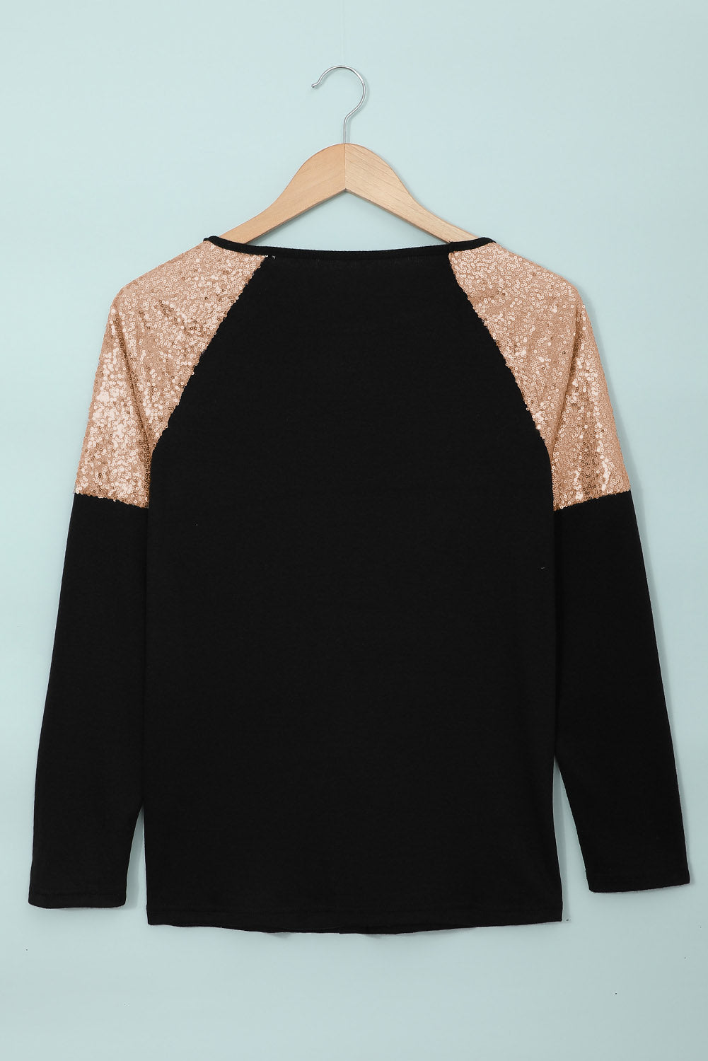 Gray long sleeve top with sequin shoulder detailing, showcasing a classic round neck and soft knit fabric.