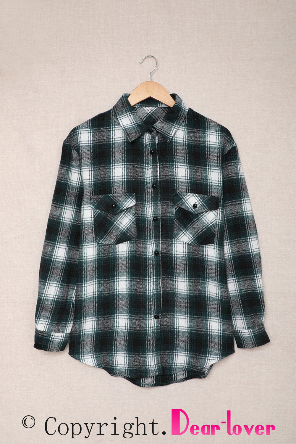 Green plaid shacket with buttons and front pockets, featuring a loose fit and turn-down collar, perfect for casual wear.