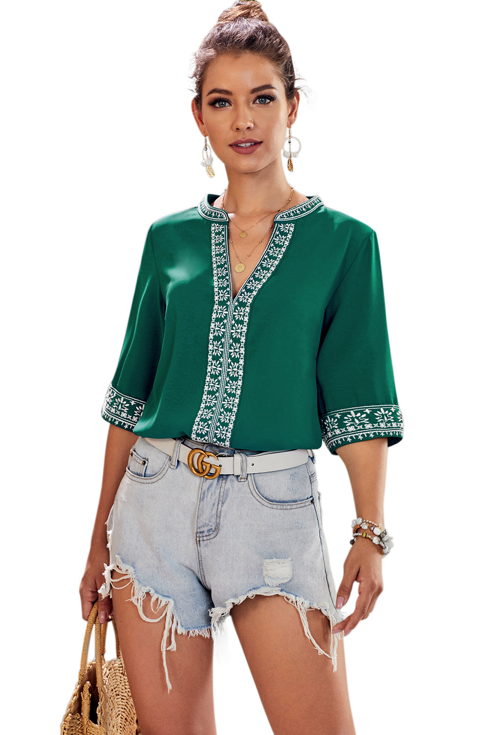 A stylish green boho blouse featuring a v-neckline and half sleeves with floral details, perfect for casual outings.