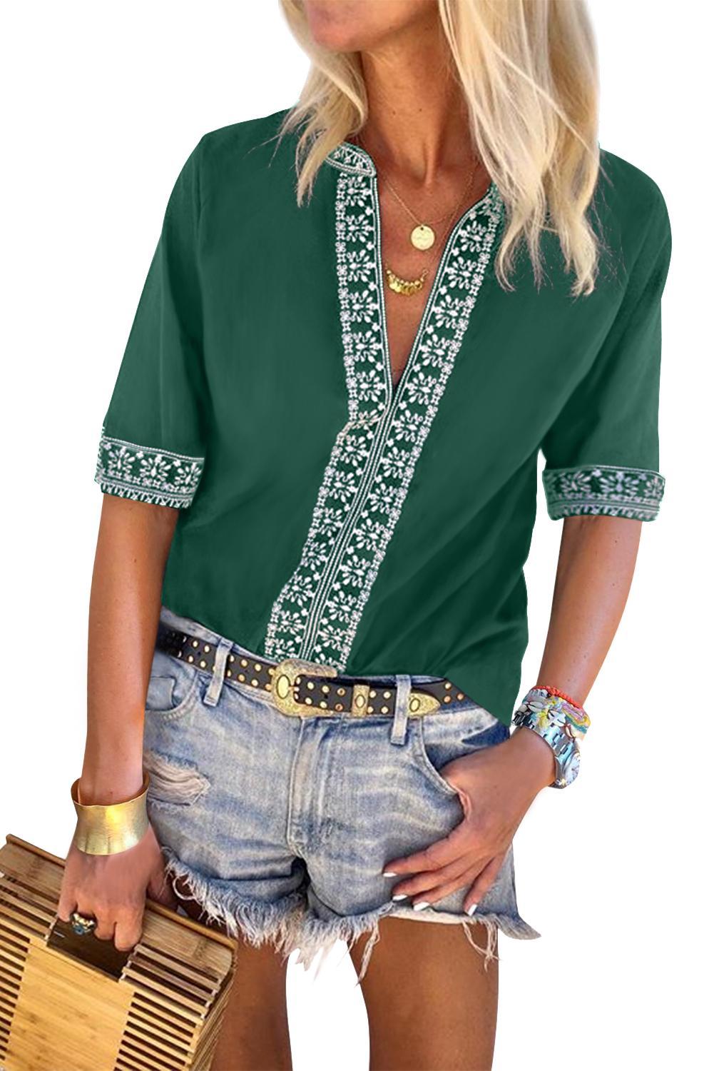 A stylish green boho blouse featuring a v-neckline and half sleeves with floral details, perfect for casual outings.