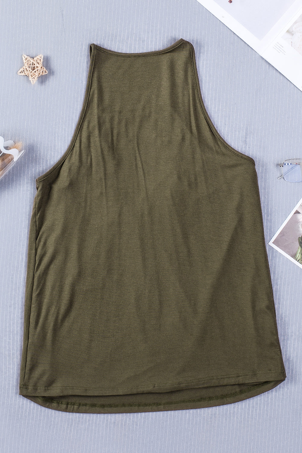 A stylish green tank top featuring intricate crochet lace detailing on the yoke, perfect for summer wear.