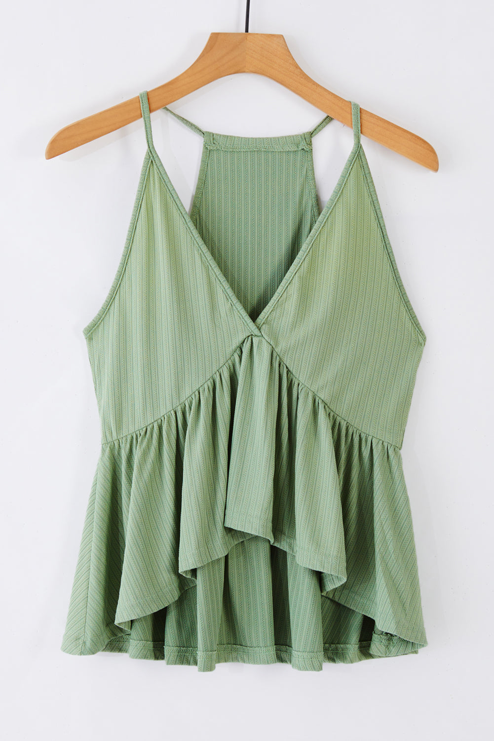 A stylish green deep V neckline ribbed babydoll tank top, perfect for summer wear, showcasing its lightweight knit material and flattering design.