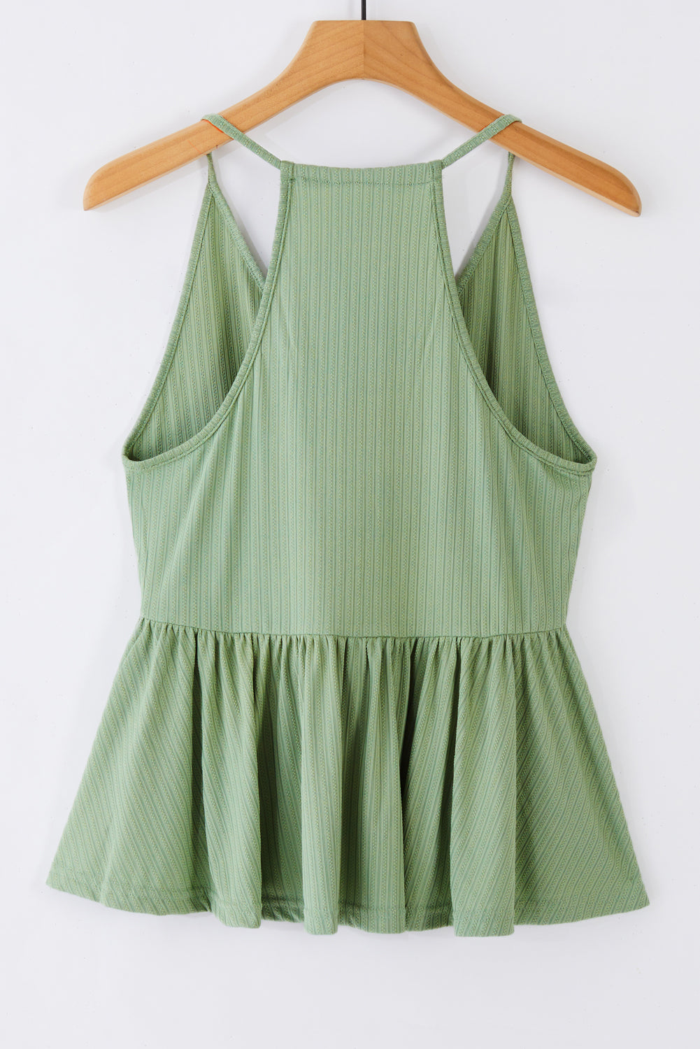 A stylish green deep V neckline ribbed babydoll tank top, perfect for summer wear, showcasing its lightweight knit material and flattering design.