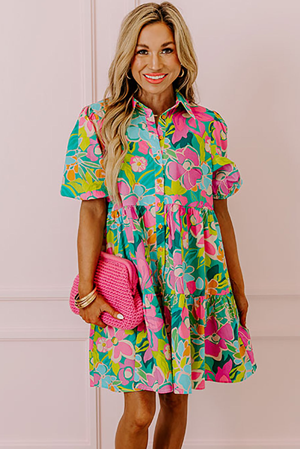 A stylish green floral puff sleeve collar buttoned babydoll dress displayed on a mannequin, showcasing its elegant design and vibrant colors.