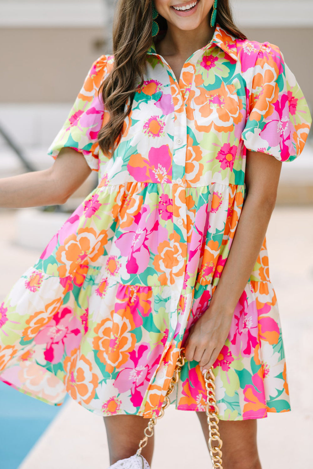 A stylish green floral puff sleeve collar buttoned babydoll dress displayed on a mannequin, showcasing its elegant design and vibrant colors.