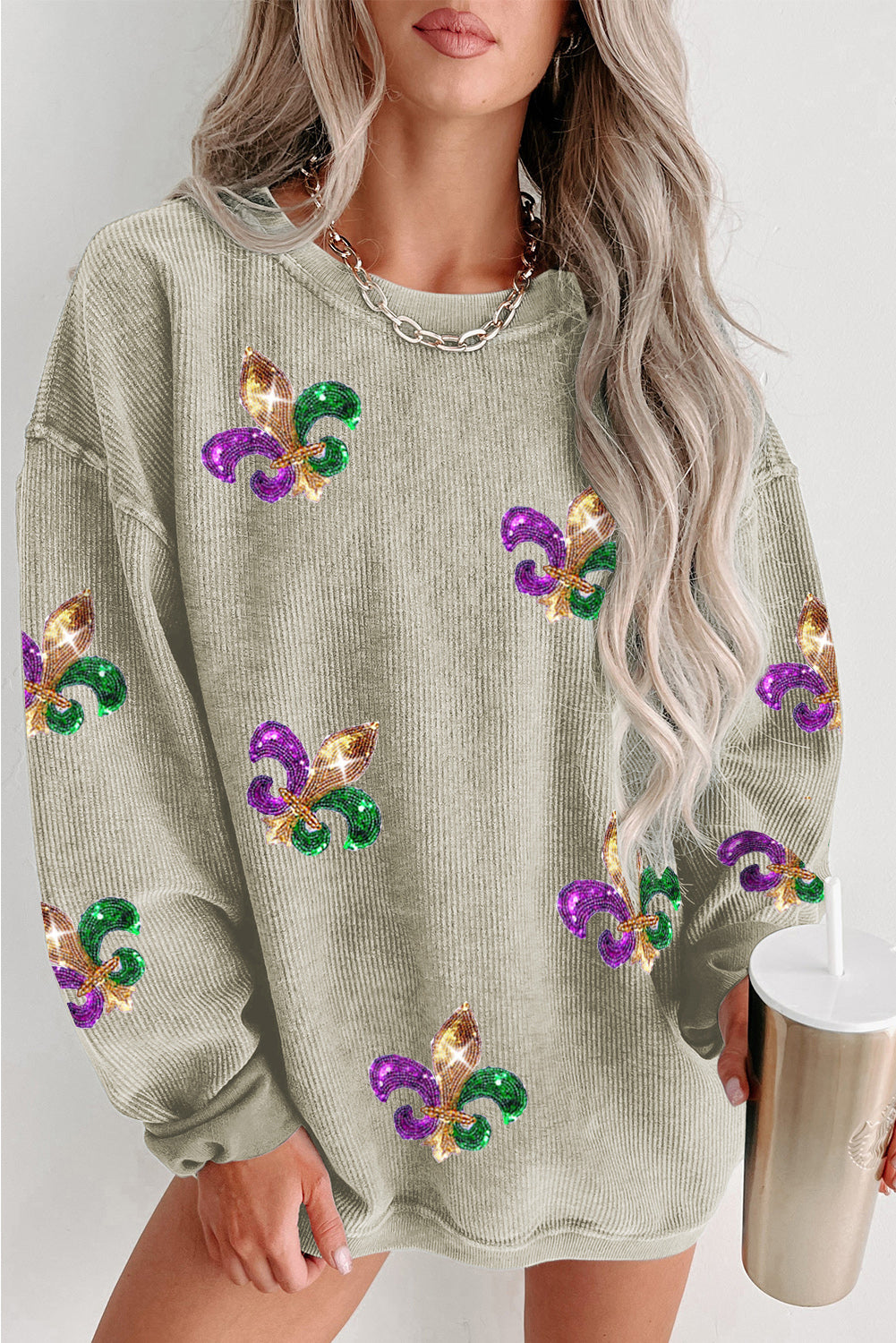 Green Glitter Mardi Gras Symbol Corded Baggy Sweatshirt featuring vibrant glitter design and relaxed fit, perfect for festive celebrations.