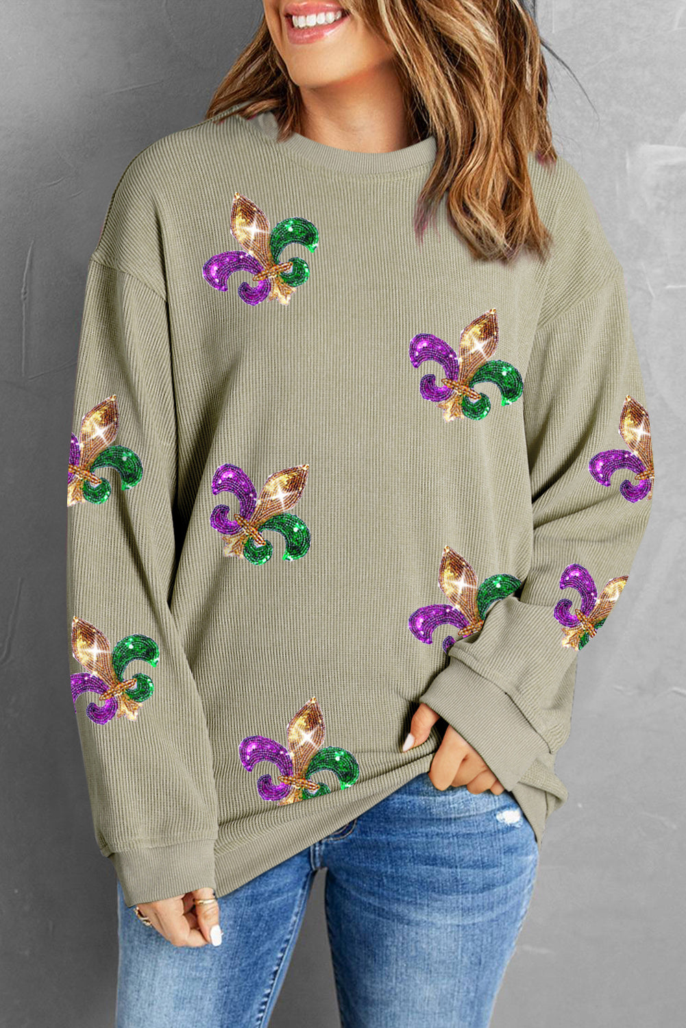 Green Glitter Mardi Gras Symbol Corded Baggy Sweatshirt featuring vibrant glitter design and relaxed fit, perfect for festive celebrations.