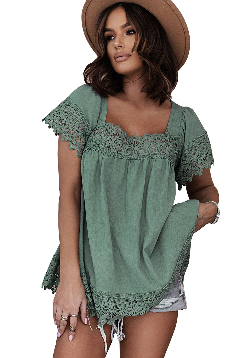 A stylish green blouse featuring lace and pom pom splicing, with a square neck and open back design, perfect for various occasions.