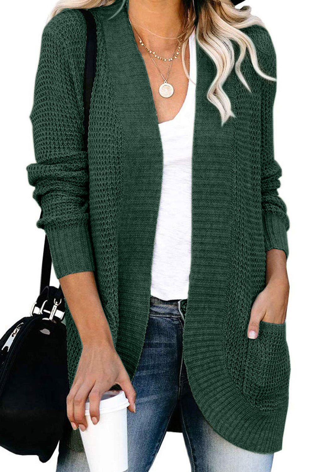 A stylish green pocket knitted solid color cardigan with a fuzzy texture and arc-shaped hem design, perfect for casual wear.