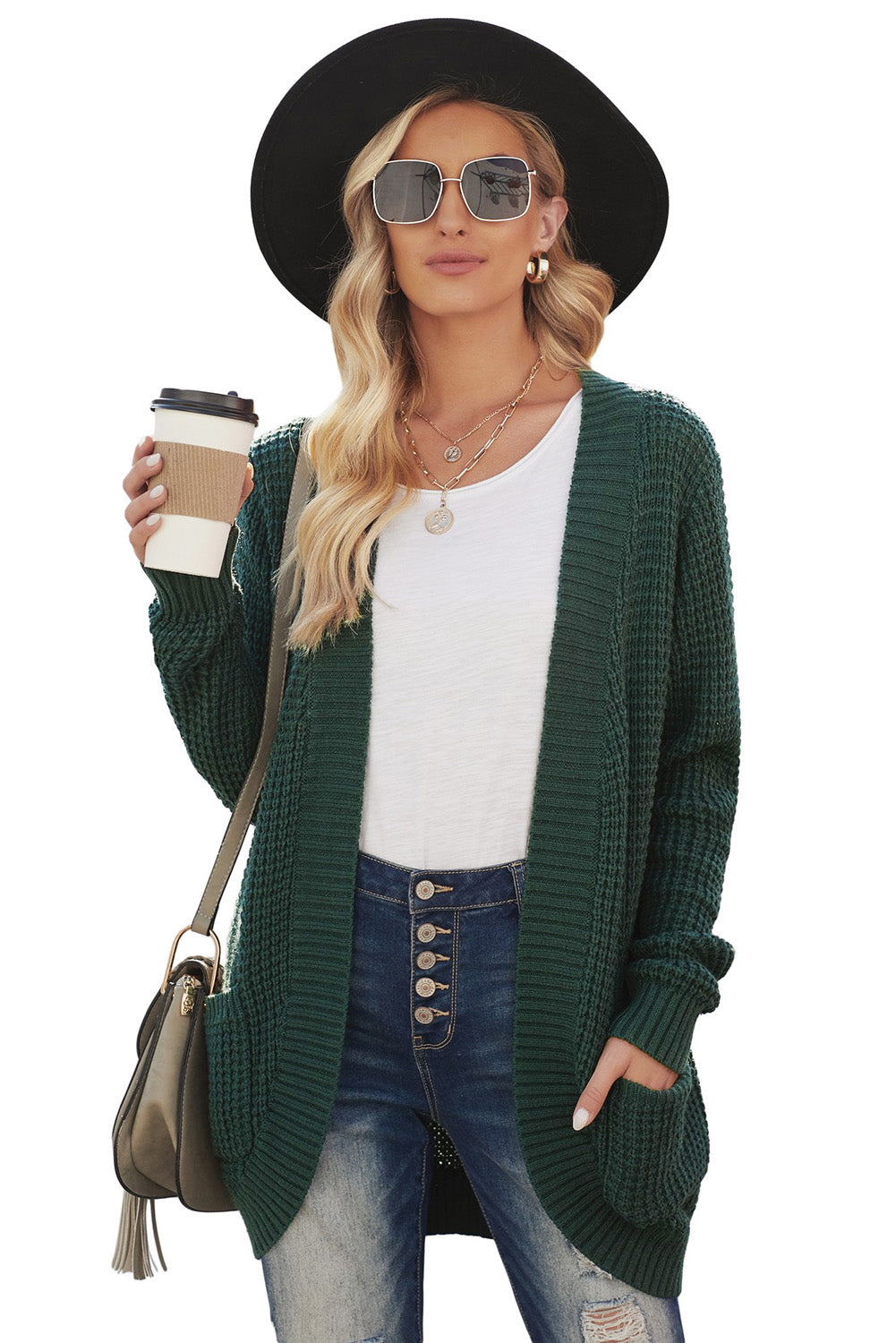 A stylish green pocket knitted solid color cardigan with a fuzzy texture and arc-shaped hem design, perfect for casual wear.