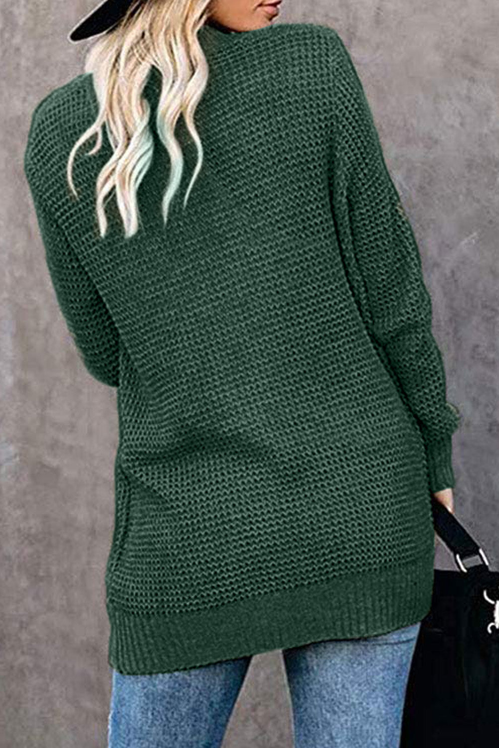 A stylish green pocket knitted solid color cardigan with a fuzzy texture and arc-shaped hem design, perfect for casual wear.