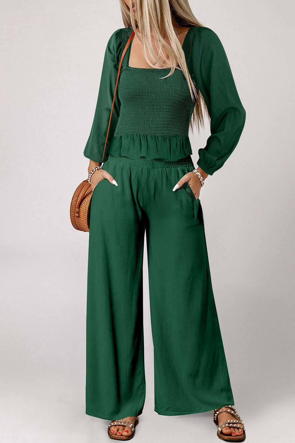 A stylish green square neck smocked peplum top paired with loose high waist pants, showcasing a feminine and elegant look.