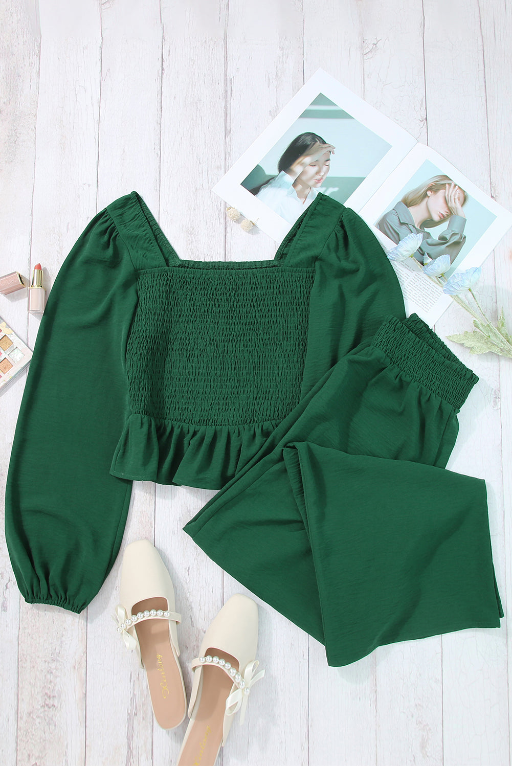 A stylish green square neck smocked peplum top paired with loose high waist pants, showcasing a feminine and elegant look.