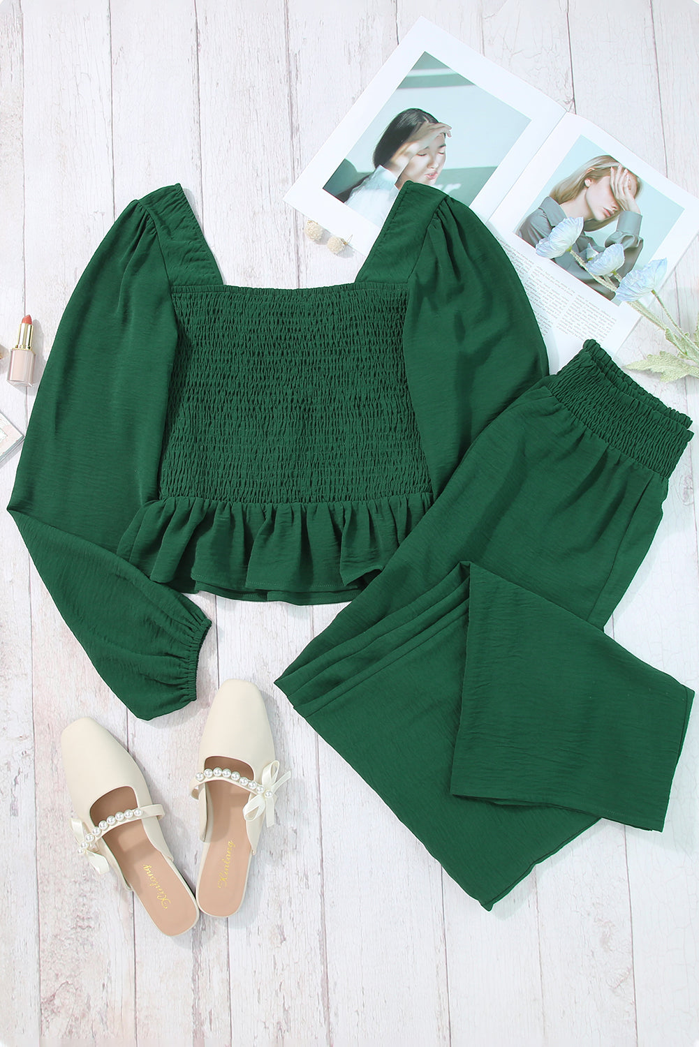 A stylish green square neck smocked peplum top paired with loose high waist pants, showcasing a feminine and elegant look.