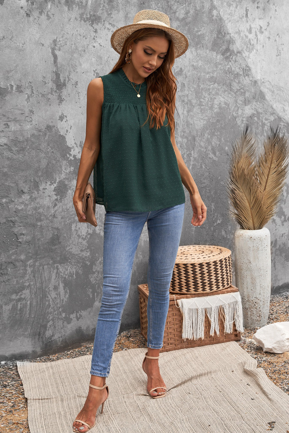 A stylish green tank top featuring Swiss dot and smocked design, with a crew neck and keyhole back, perfect for summer wear.