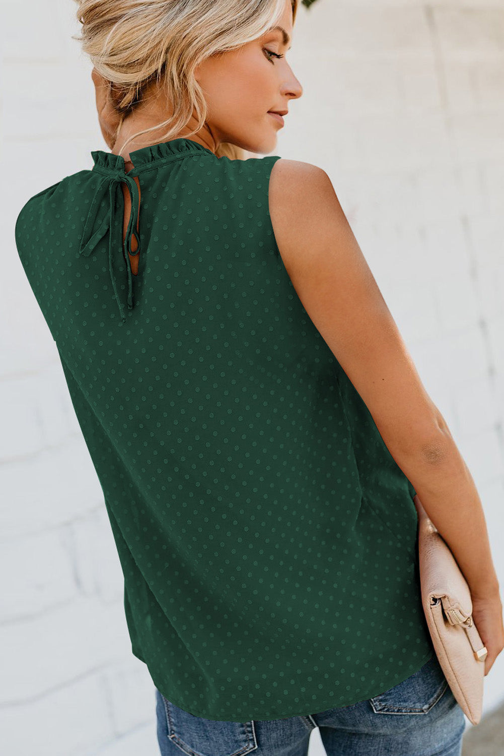 A stylish green tank top featuring Swiss dot and smocked design, with a crew neck and keyhole back, perfect for summer wear.